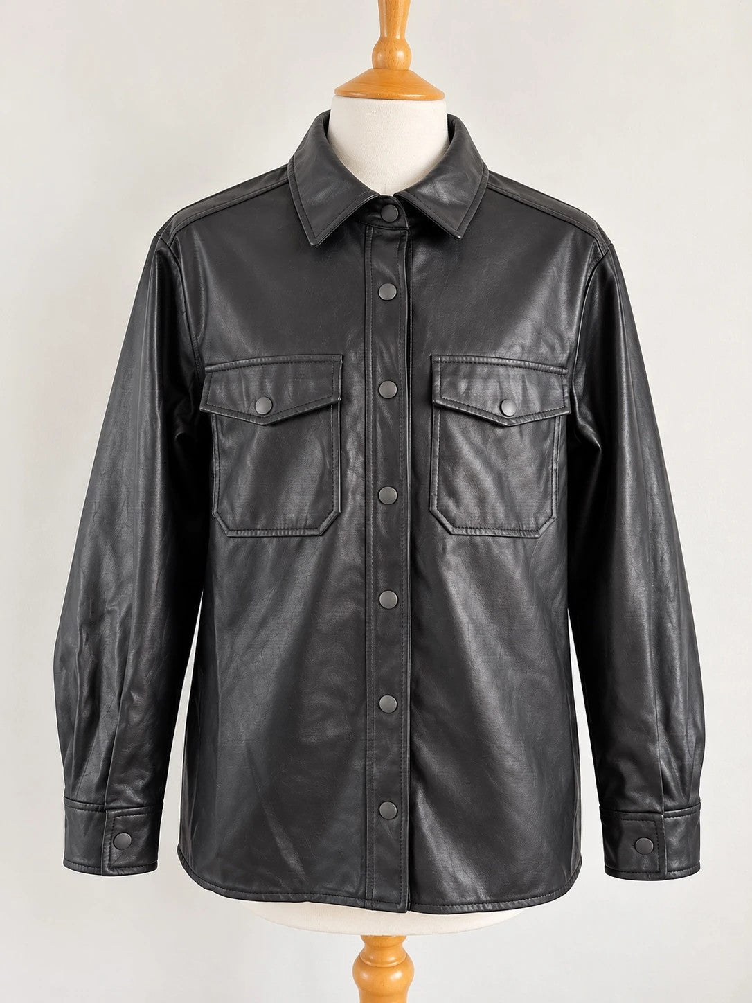 Topshop black faux leather shacket with classic collar and press-stud front fastening.