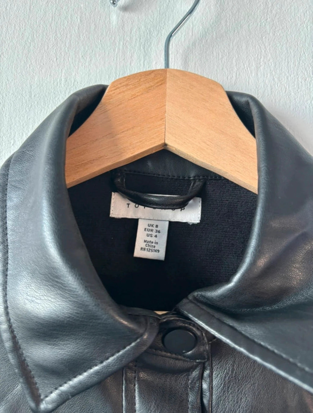 Topshop black faux leather shacket with classic collar and press-stud front fastening.